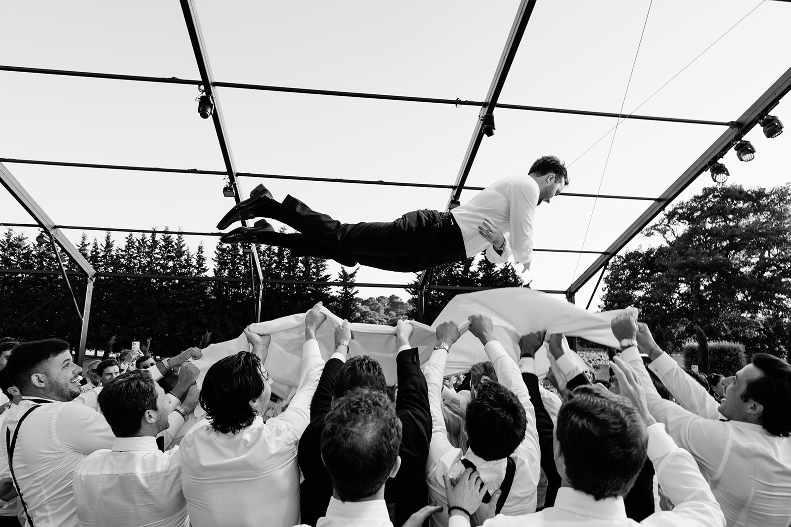 Bride and groom celebrating during their Villa Baulieu wedding reception